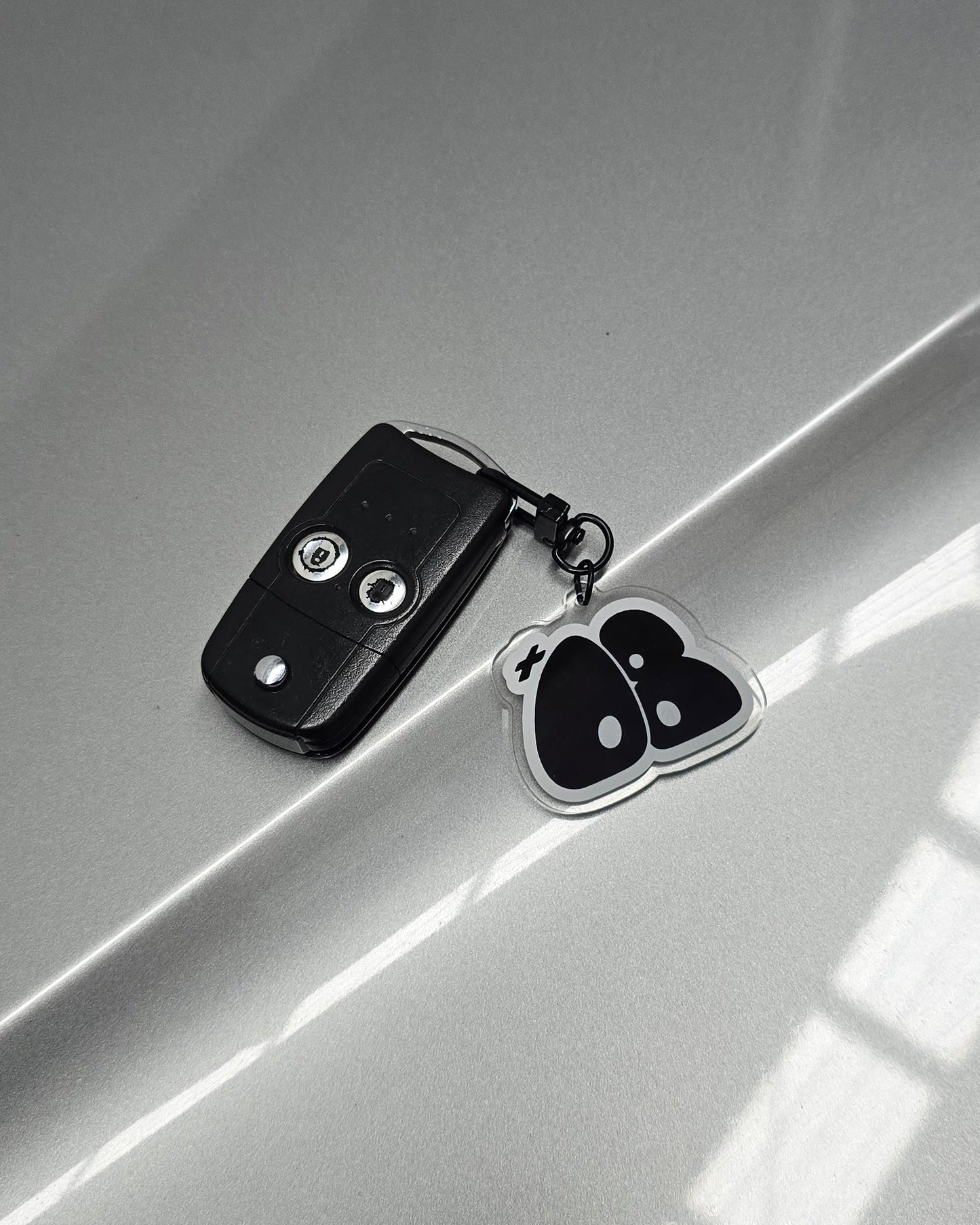 "+08" Bubble Logo Key Chain