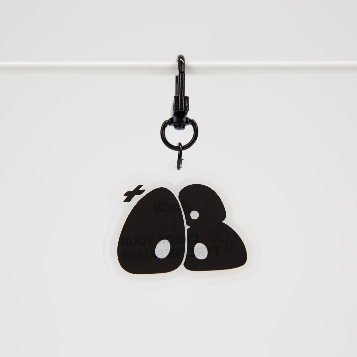 Black keychain with a design on a white background