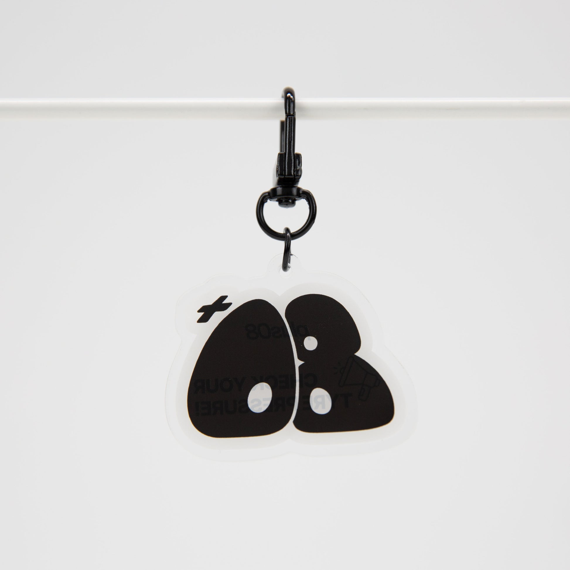Black keychain with a design on a white background